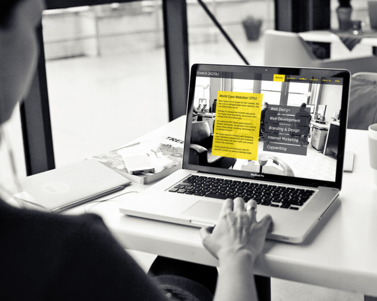 man on laptop looking at e9digital website