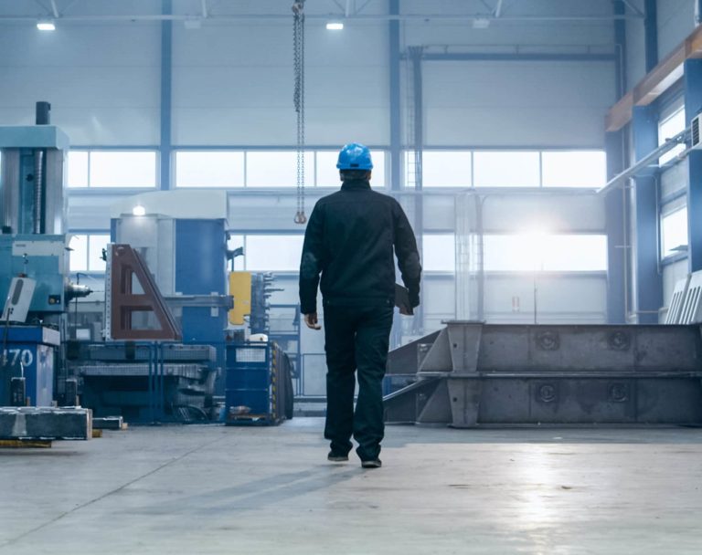 man walking in warehouse